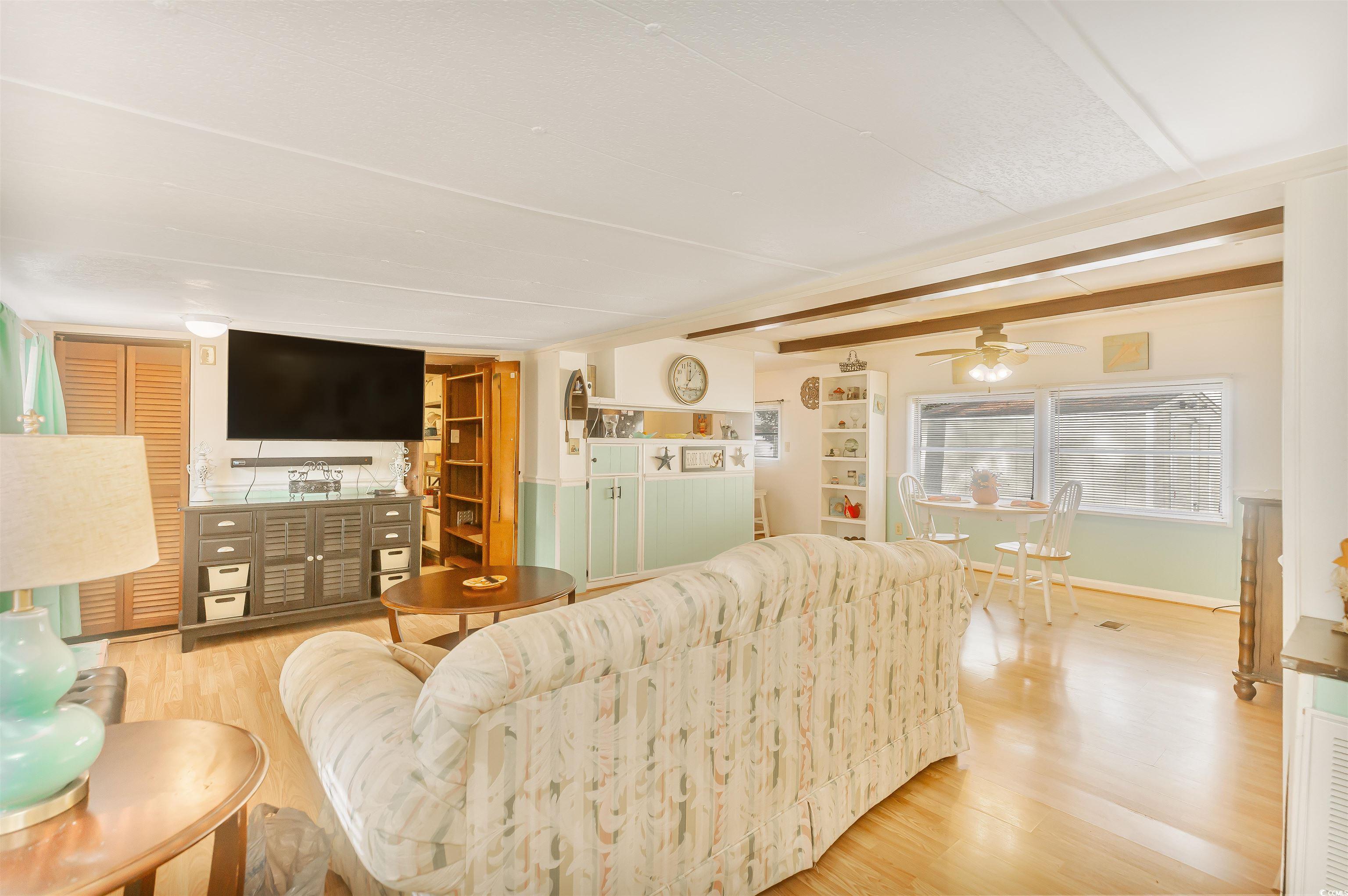 382 West Canal Street Murrells Inlet, SC 29576 - Photo 12 of 38 Living room featuring ceiling fan and light wood-type flooring