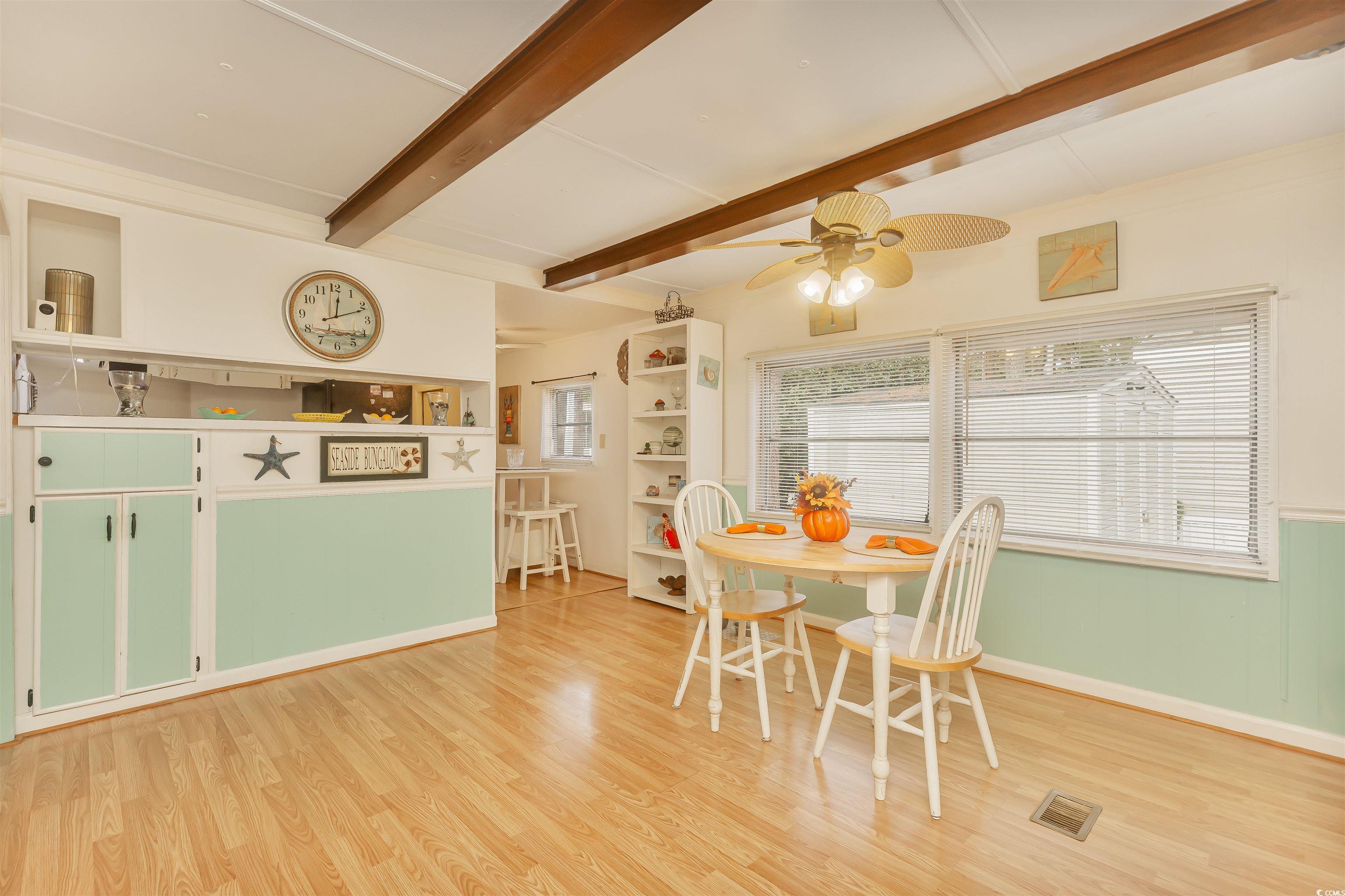 382 West Canal Street Murrells Inlet, SC 29576 - Photo 14 of 38 Dining area with ceiling fan, beamed ceiling, and light wood-type flooring