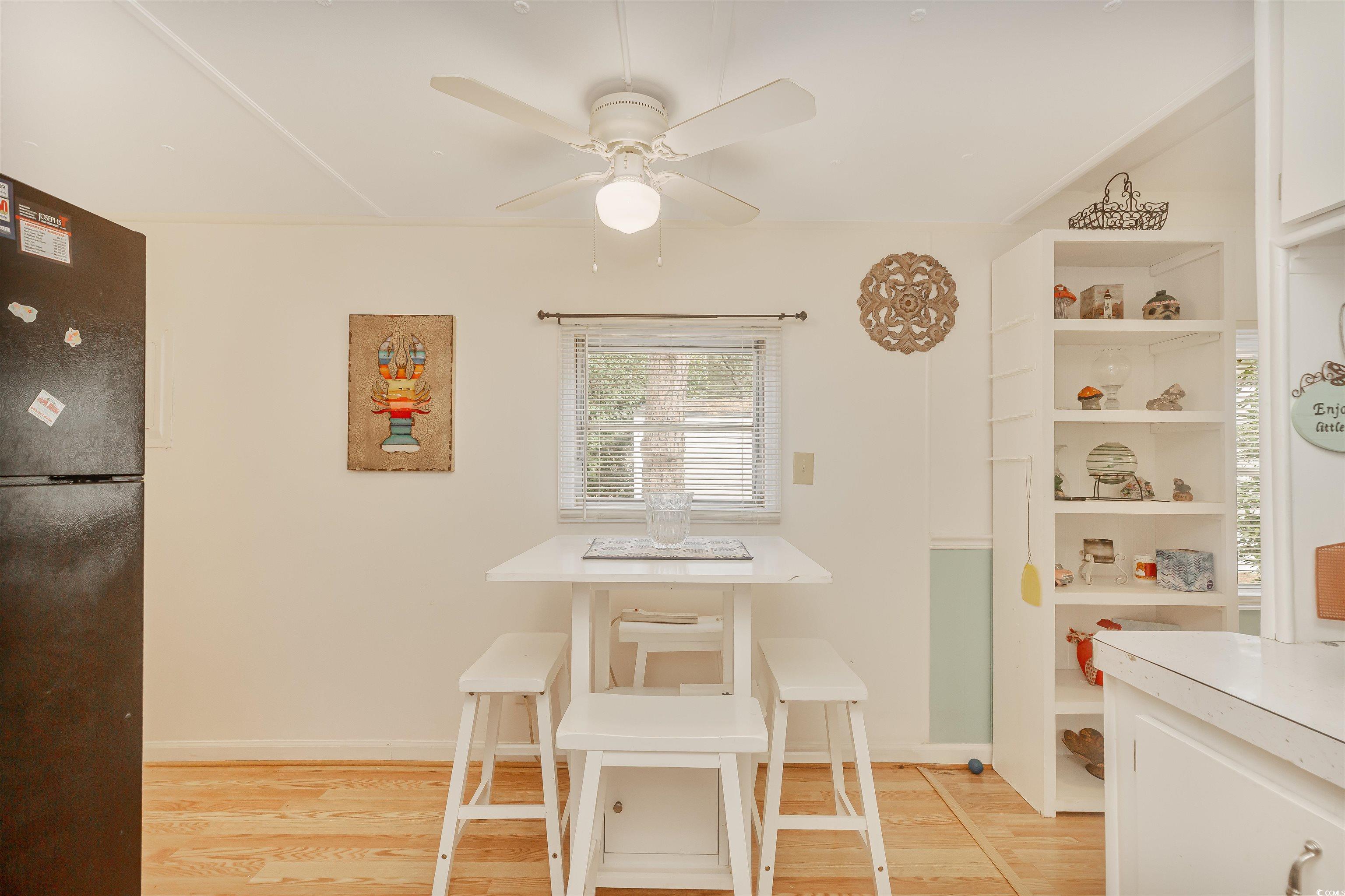 382 West Canal Street Murrells Inlet, SC 29576 - Photo 18 of 38 Dining space with light hardwood / wood-style flooring and ceiling fan