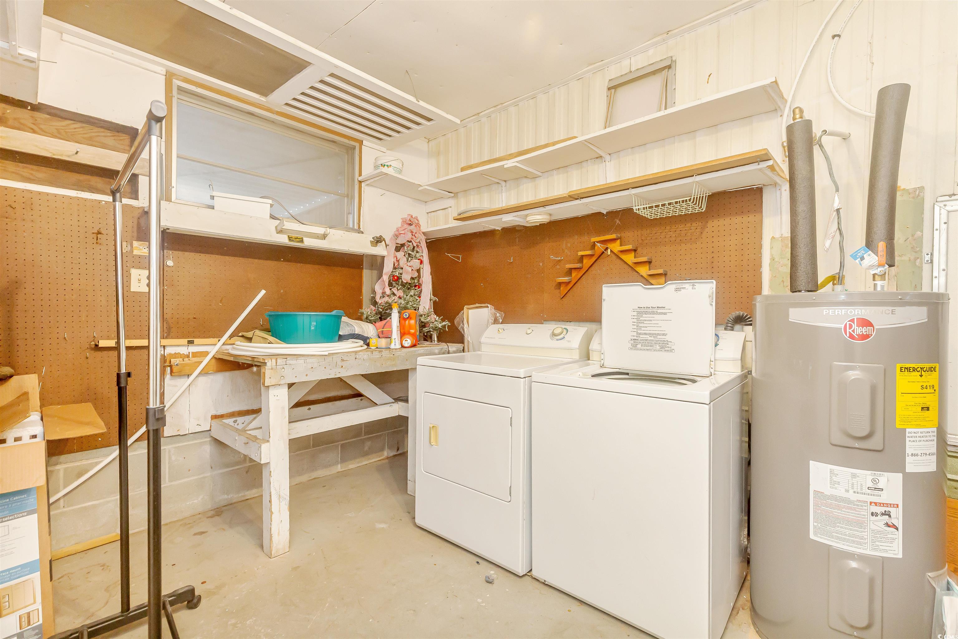 382 West Canal Street Murrells Inlet, SC 29576 - Photo 30 of 38 Clothes washing area with washing machine and dryer and electric water heater