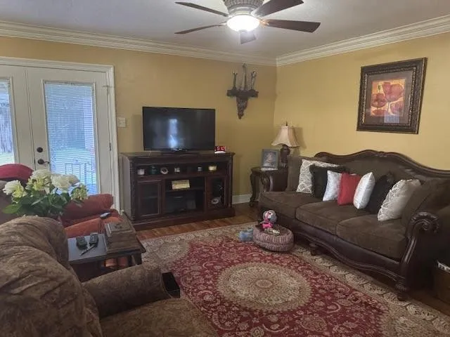 a living room with furniture and a flat screen tv