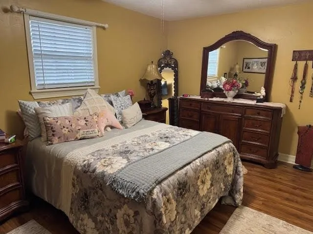 a bedroom with a bed and a dresser