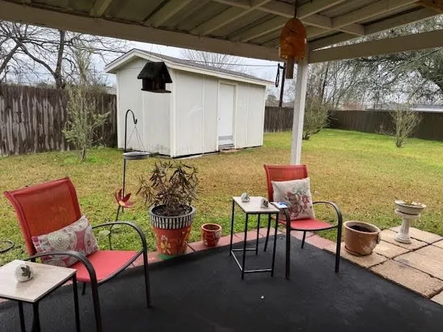 a patio with table and chairs