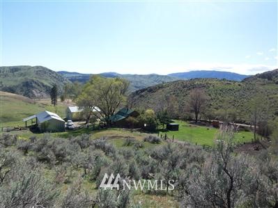 120 Limebelt Road Riverside, WA 98849 - Photo 1 of 1 a view of a grassy field with trees