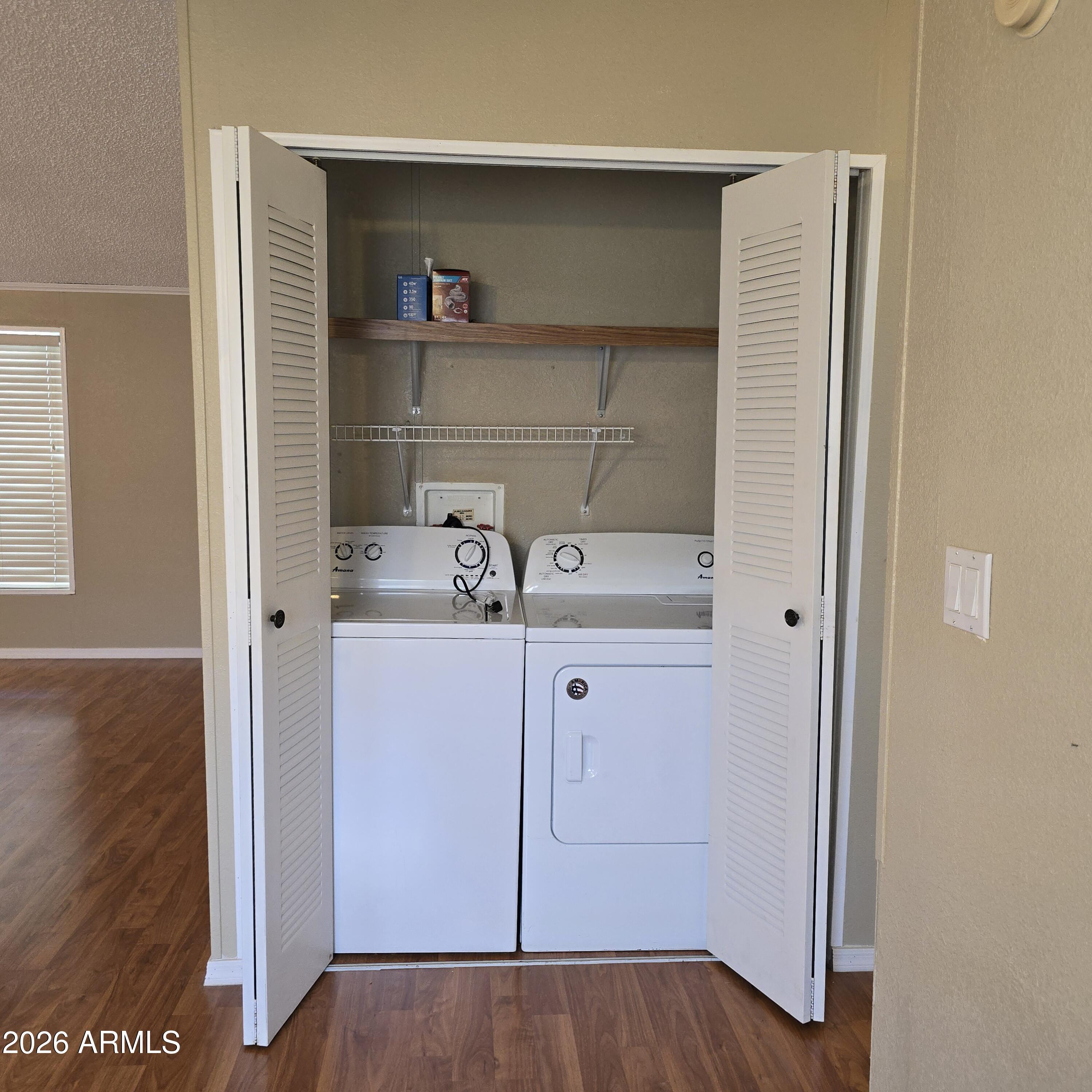 205 West Bell Road, Unit 131 Phoenix, AZ 85023 - Photo 11 of 47 a view of cabinets and wooden floor
