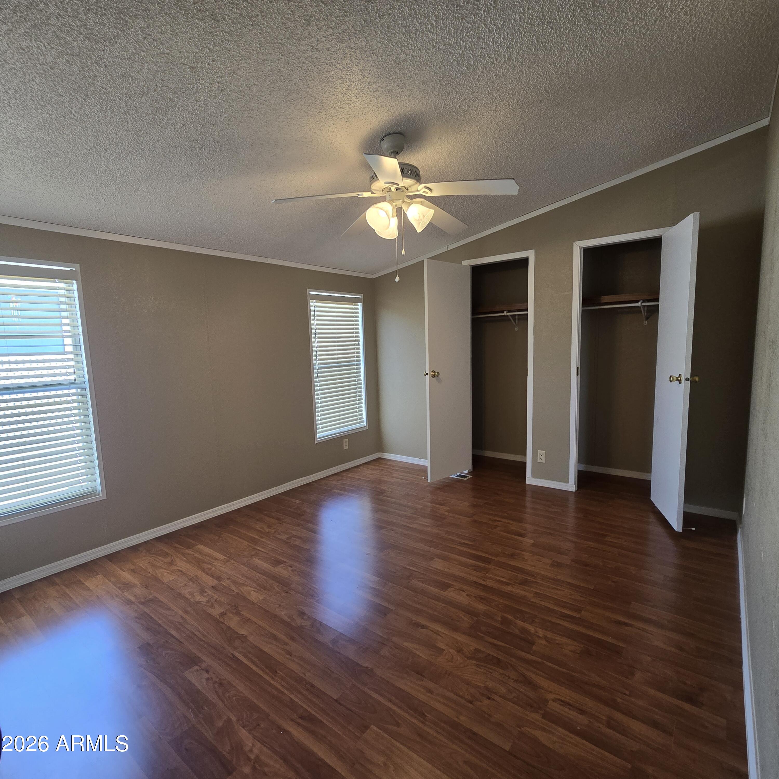 205 West Bell Road, Unit 131 Phoenix, AZ 85023 - Photo 12 of 47 a view of an empty room with wooden floor and a window