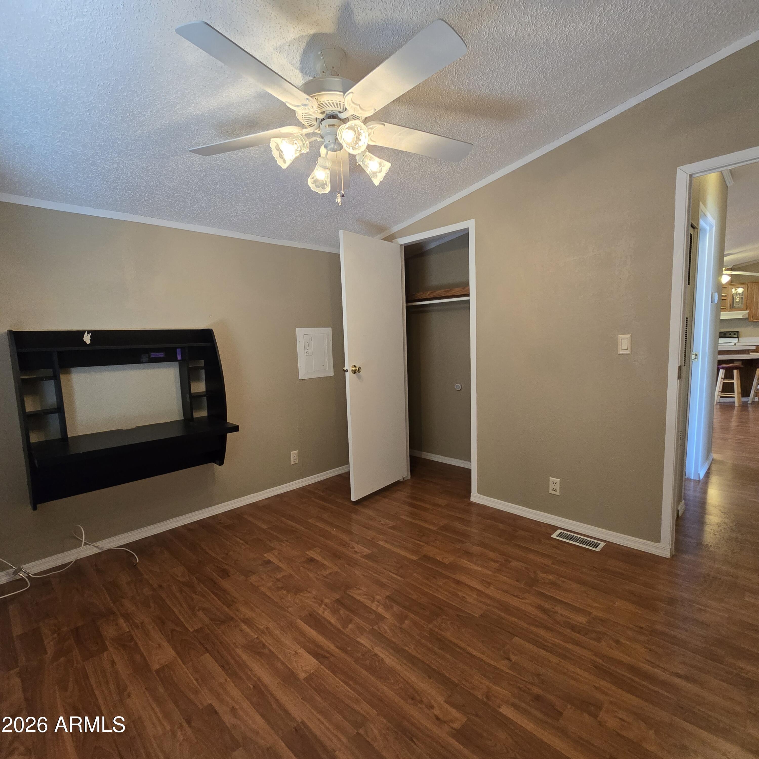 205 West Bell Road, Unit 131 Phoenix, AZ 85023 - Photo 21 of 47 a view of an empty room with wooden floor and a fireplace