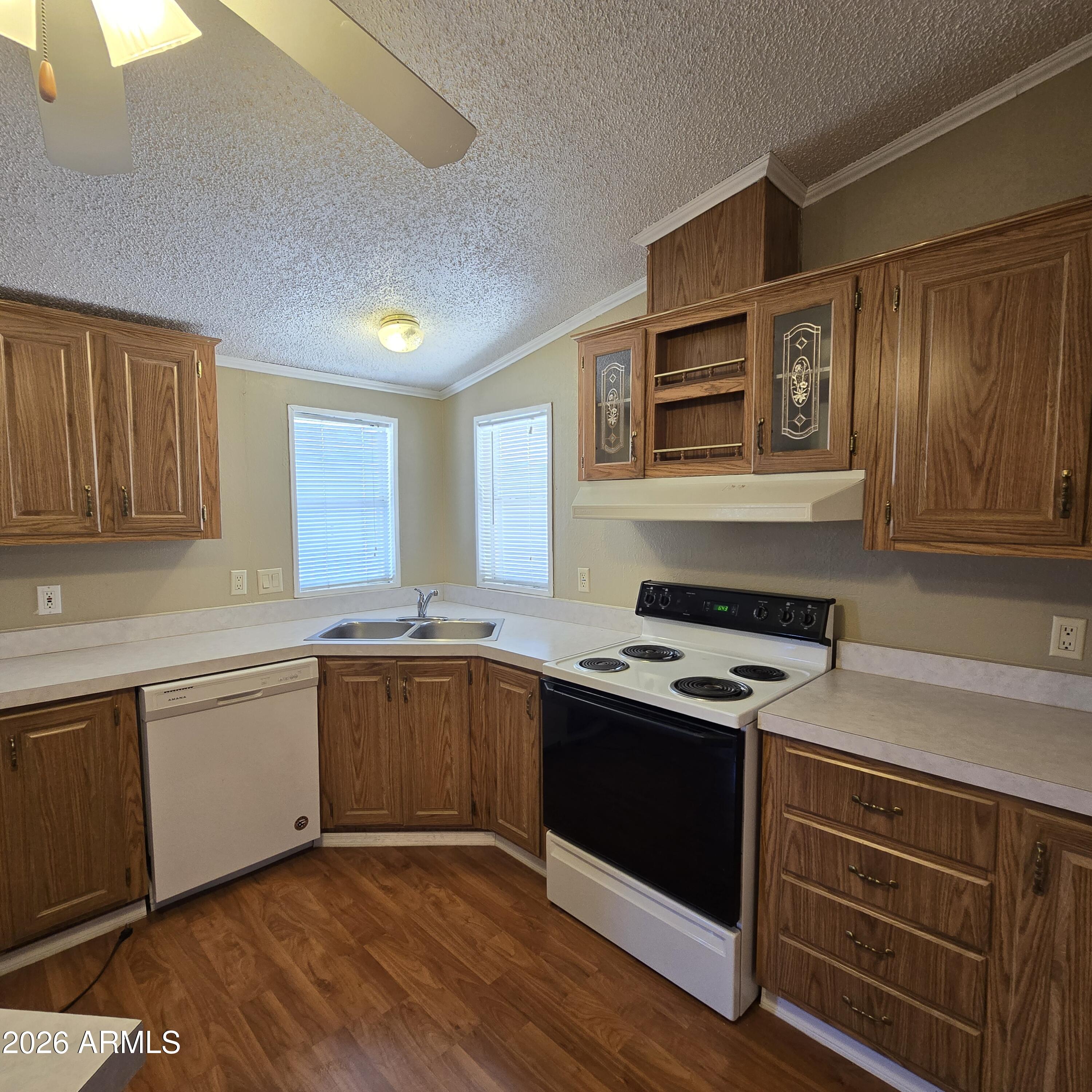 205 West Bell Road, Unit 131 Phoenix, AZ 85023 - Photo 22 of 47 a kitchen with stainless steel appliances granite countertop a stove and a sink