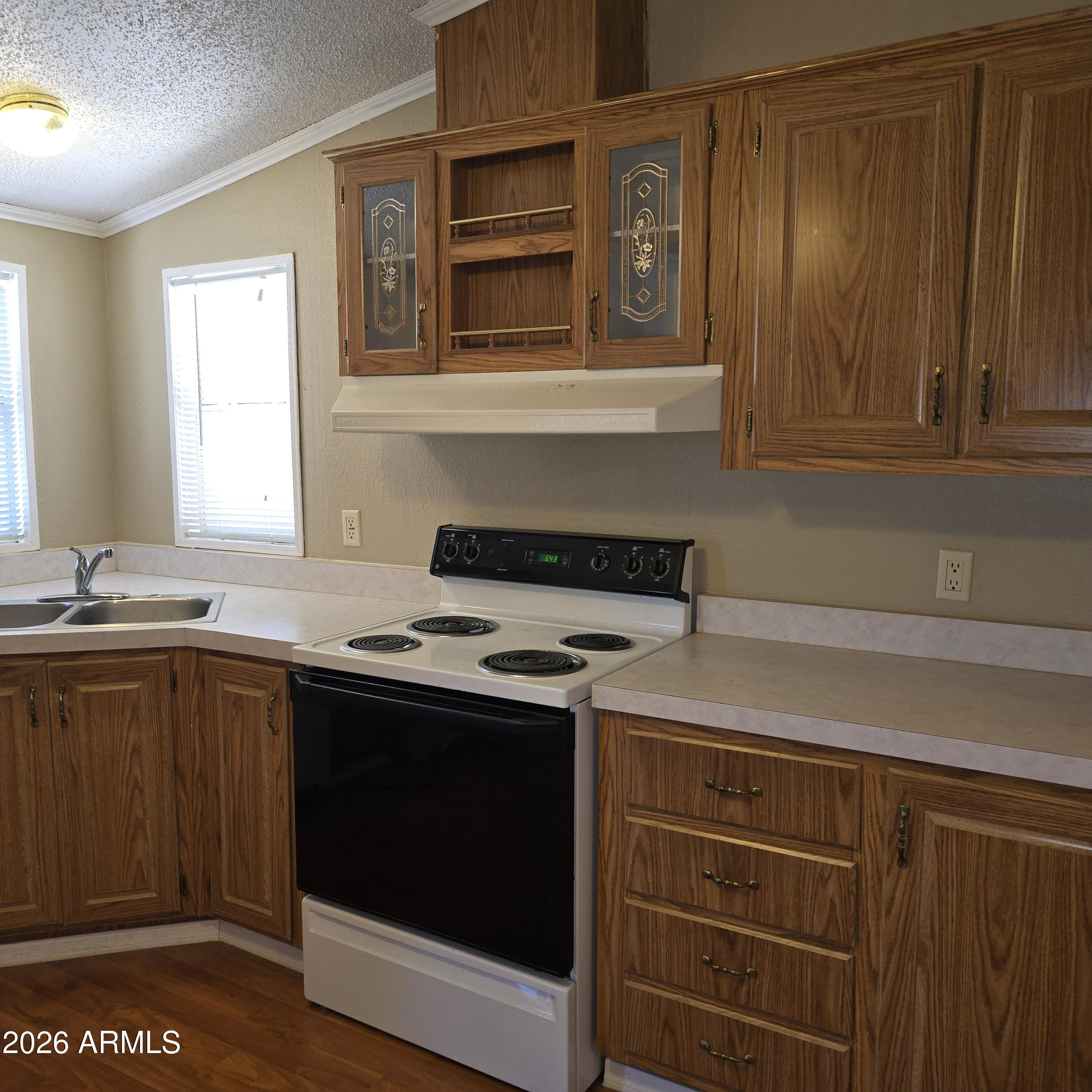 205 West Bell Road, Unit 131 Phoenix, AZ 85023 - Photo 23 of 47 a kitchen with a stove and a sink