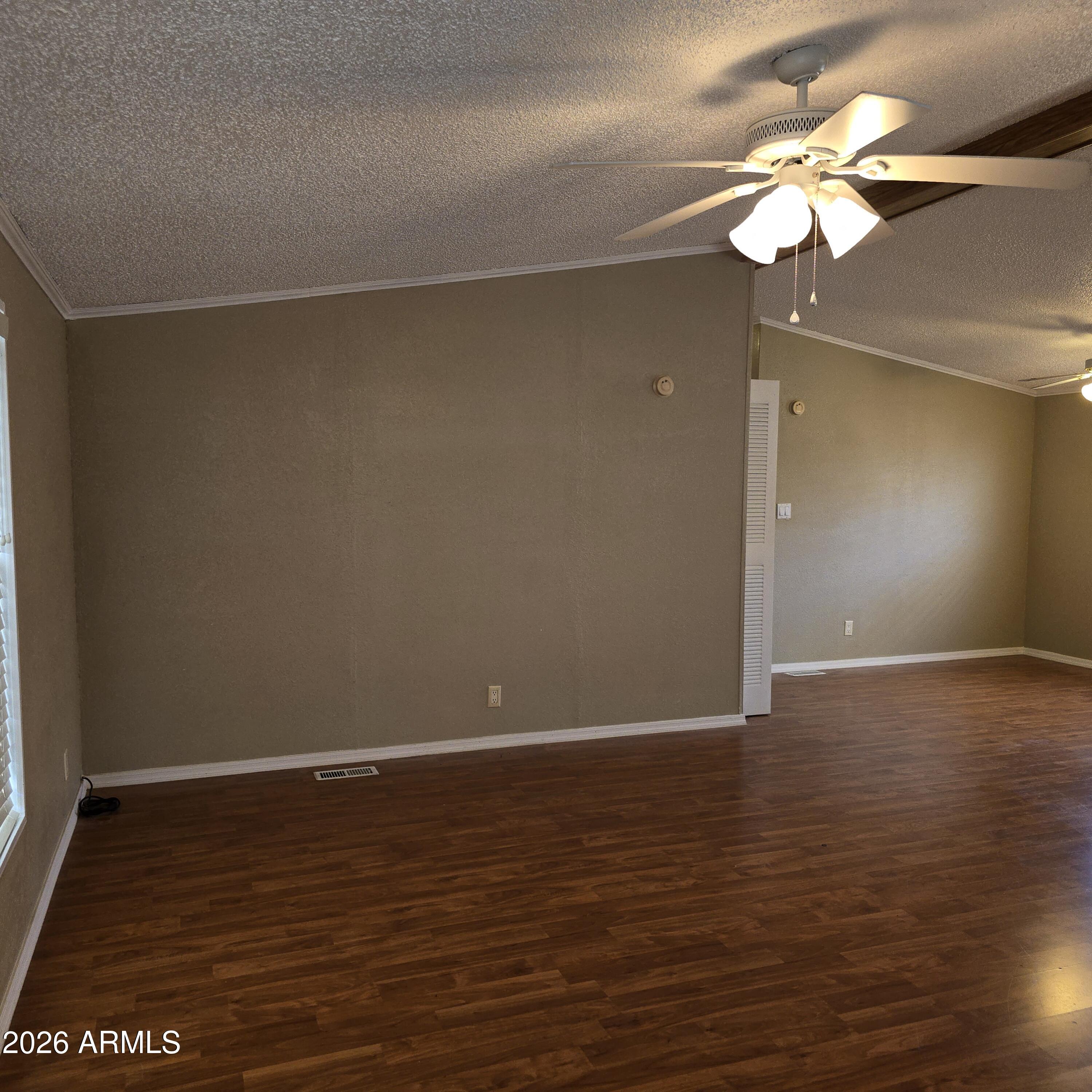 205 West Bell Road, Unit 131 Phoenix, AZ 85023 - Photo 5 of 47 a view of an empty room with a chandelier fan