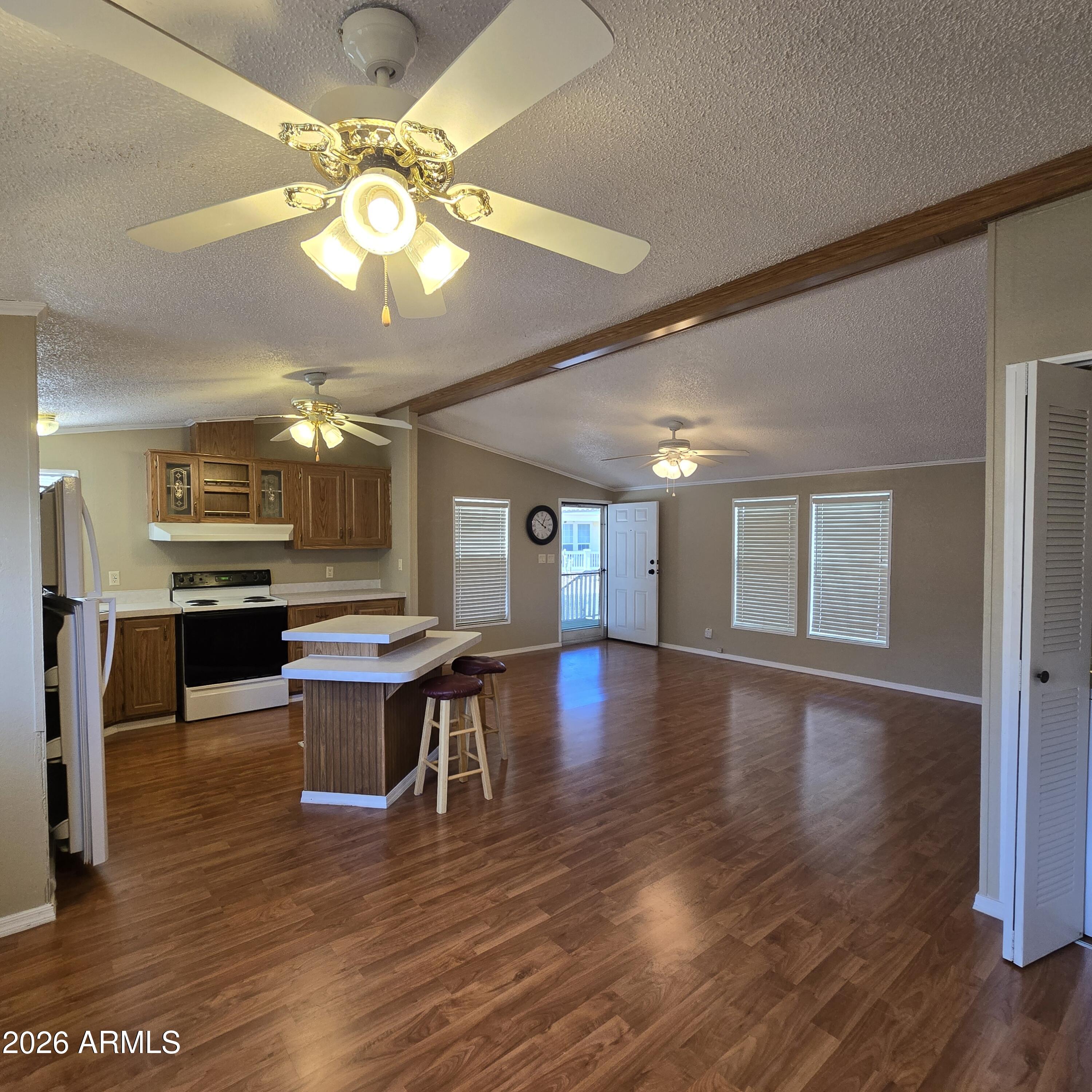 205 West Bell Road, Unit 131 Phoenix, AZ 85023 - Photo 10 of 47 a view of a dining room with furniture and wooden floor