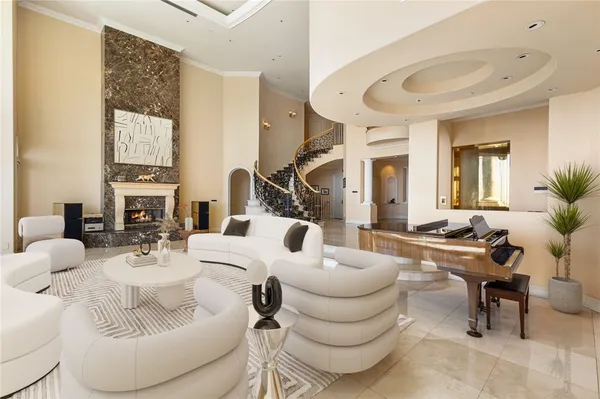 a view of a livingroom with furniture and a fireplace