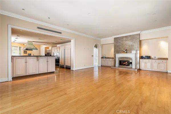 a large white kitchen with a large window