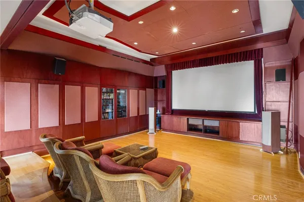 a living room with furniture and large windows