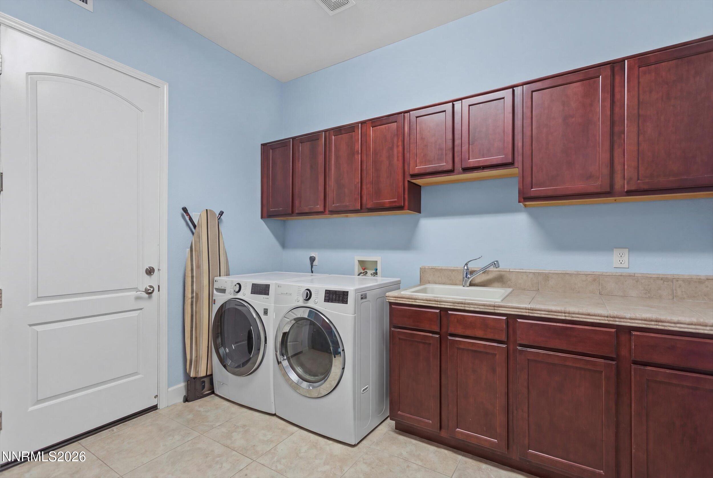 2920 Bull Rider Drive Reno, NV 89521 - Photo 13 of 51 a utility room with sink dryer and washer