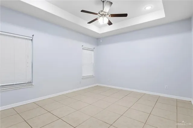 a bathroom with double vanity sinks and a mirror