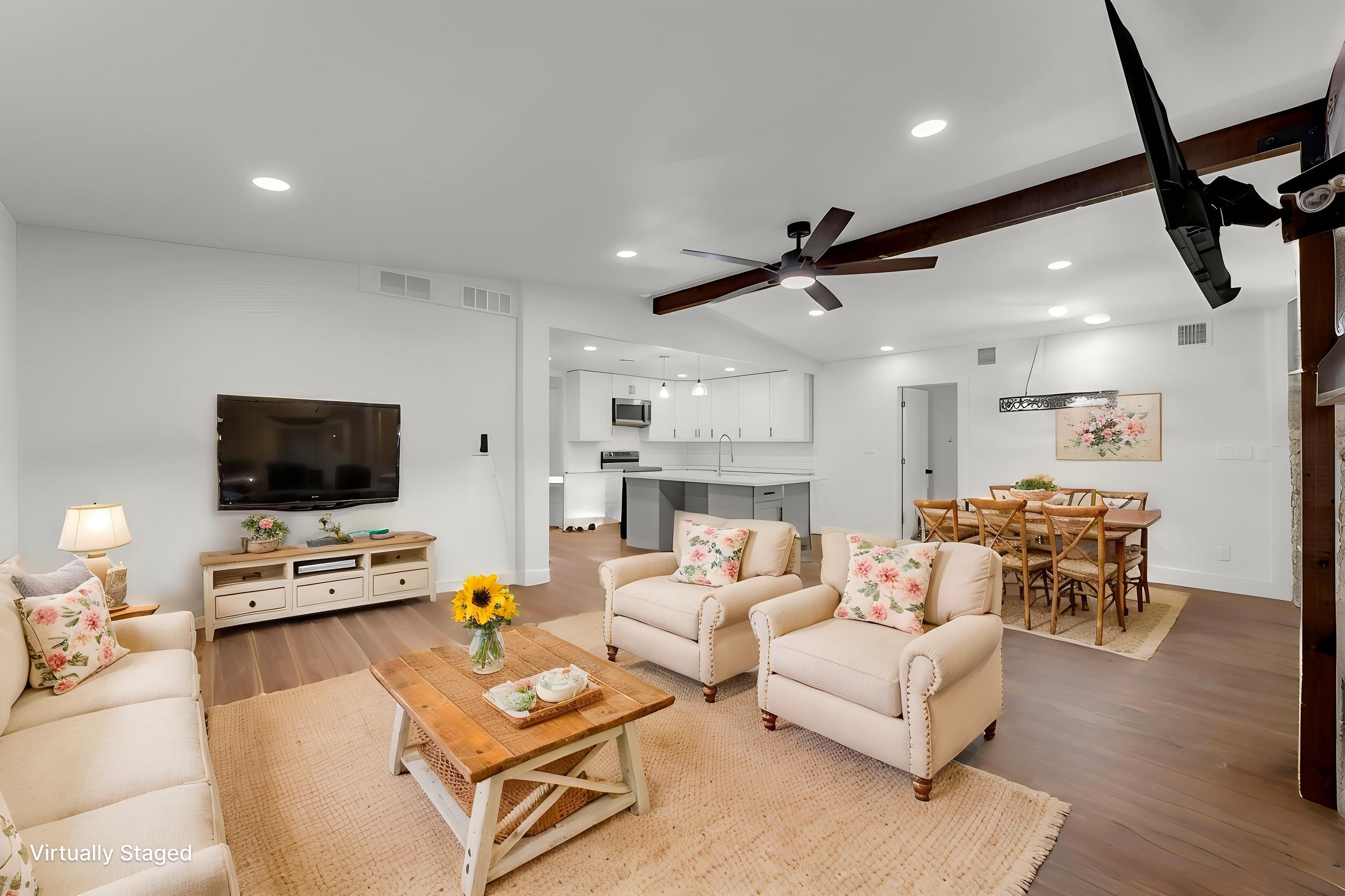 407 East Kerr Street Burnet, TX 78611 - Photo 2 of 21 a living room with furniture and a flat screen tv