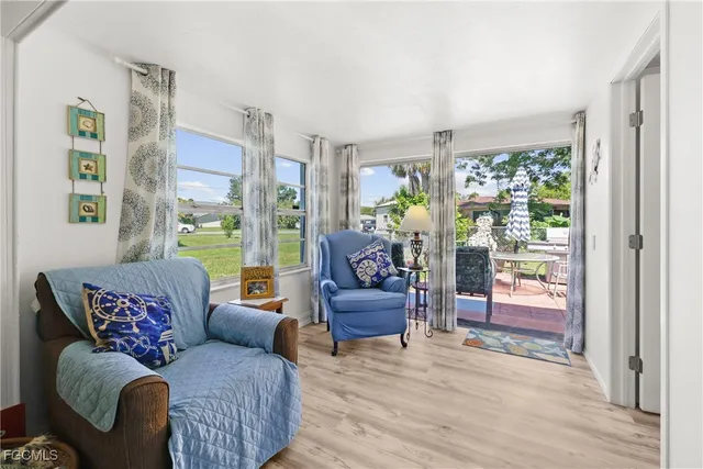 a living room with furniture and a window