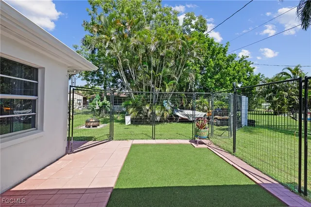 a view of a park with large trees