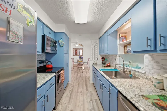 a kitchen with granite countertop lots of counter top space