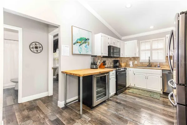 a kitchen with a microwave a stove and a microwave