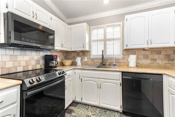 a bathroom with a sink a toilet a mirror a vanity and shower