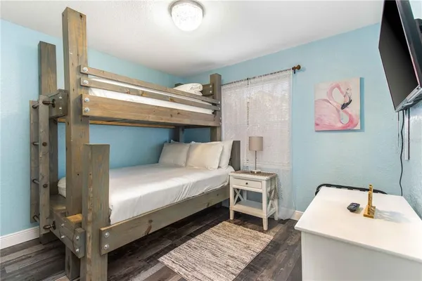 a large white bed in a white room