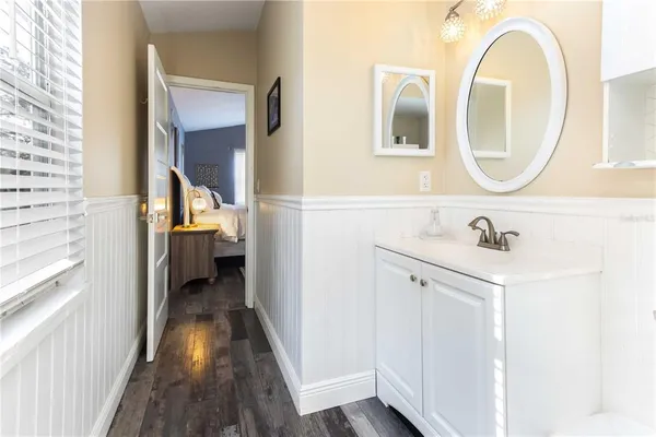 a view of a house with backyard porch and sitting area