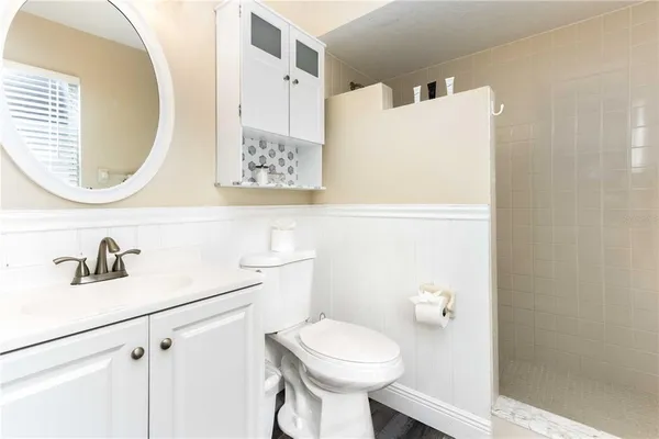 a view of a backyard with a table and chairs