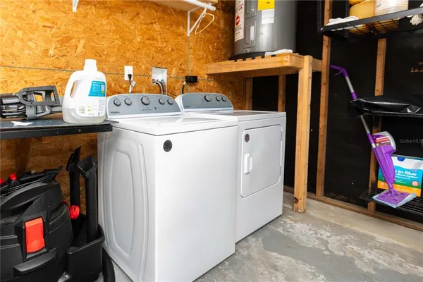 a kitchen with stainless steel appliances granite countertop a refrigerator and a stove