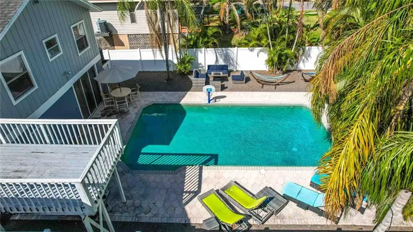a bedroom with furniture and a flat screen tv