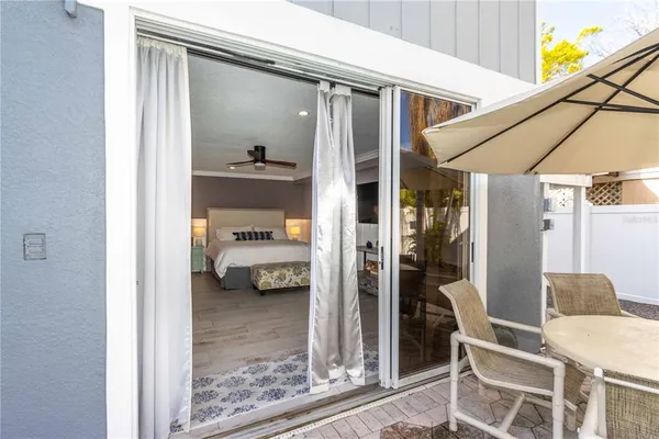 a bed room with a bed and a chair