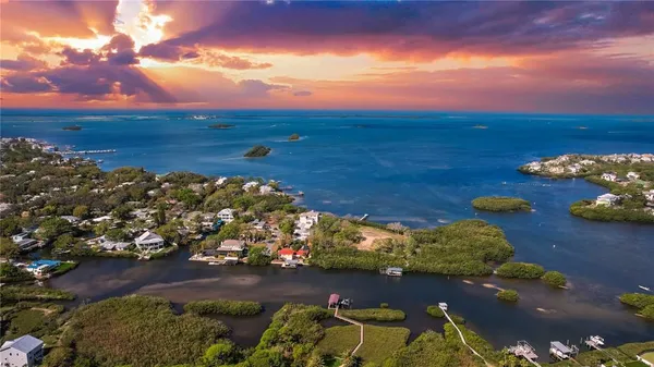 a living room with furniture a window and chairs