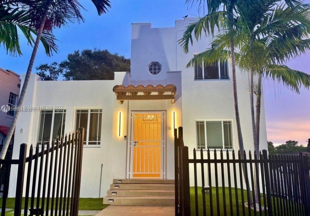 6 Northeast 50th Street Miami, FL 33137 - Photo 1 of 14 a front view of a house with a garden