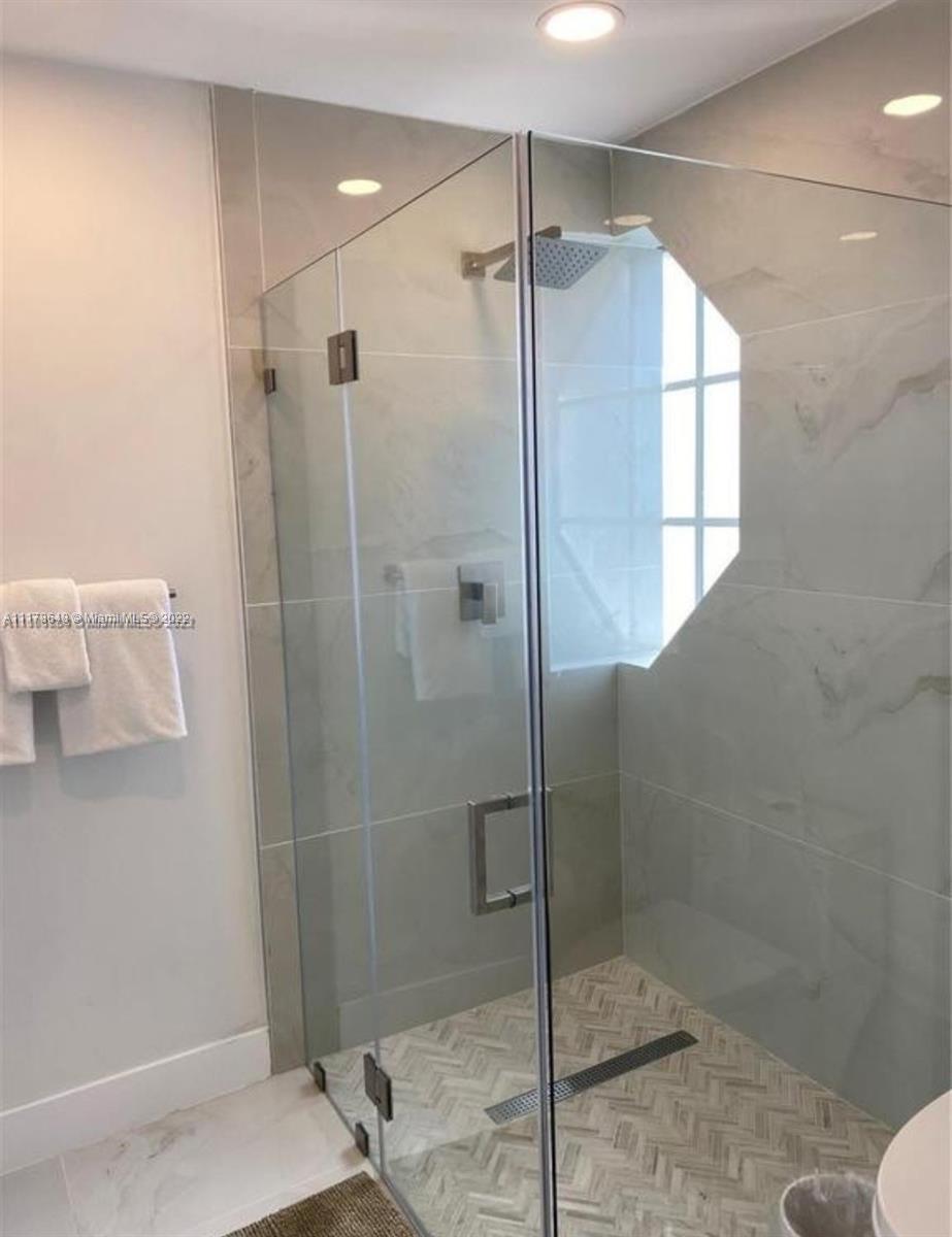 6 Northeast 50th Street Miami, FL 33137 - Photo 8 of 14 a bathroom with a shower and a toilet