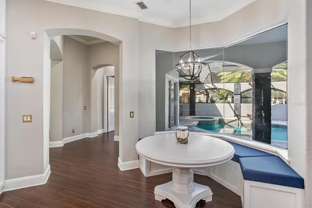 a view of a dining room with furniture window and wooden floor
