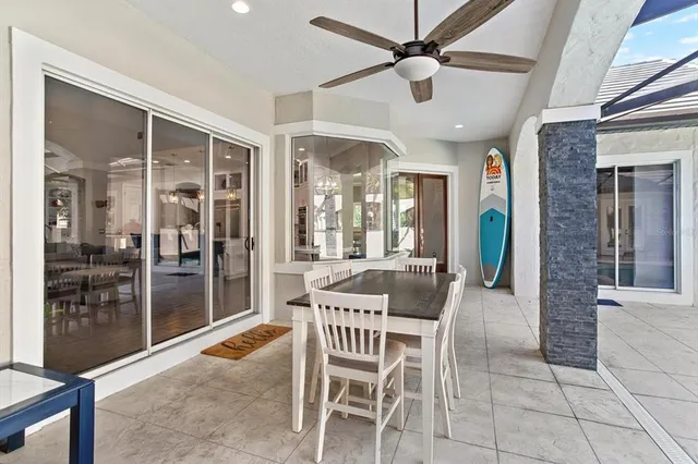 a dining room with furniture and window