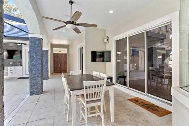 a dining room with furniture and window