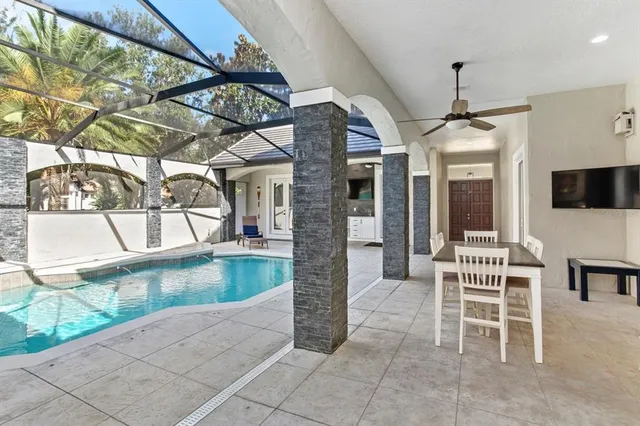 a view of a chairs and table in the patio