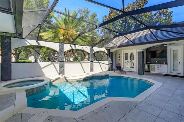 a view of a swimming pool with a patio