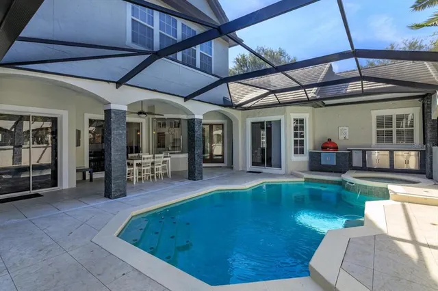 a view of a patio with table and chairs and potted plants