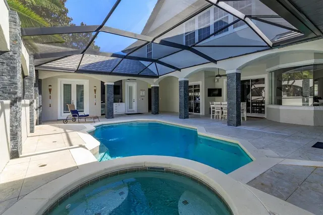 a view of a chairs and table in the patio