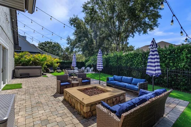 a view of a backyard with sitting area