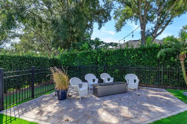 a view of a couches and a fire pit in the yard