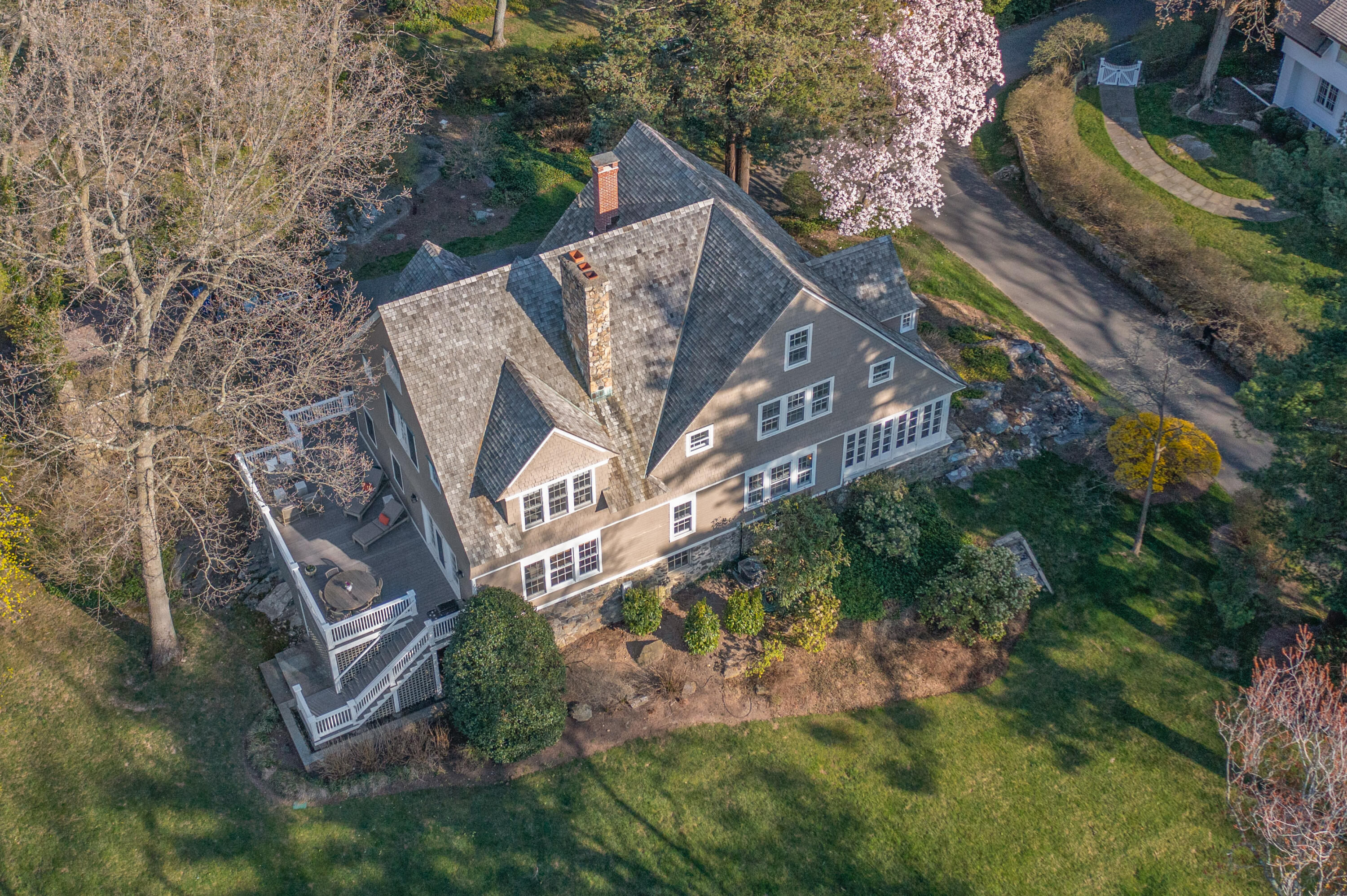 3 Edgehill Drive Darien, CT 06820 - Photo 1 of 40 a view of a yard with plants and a bench
