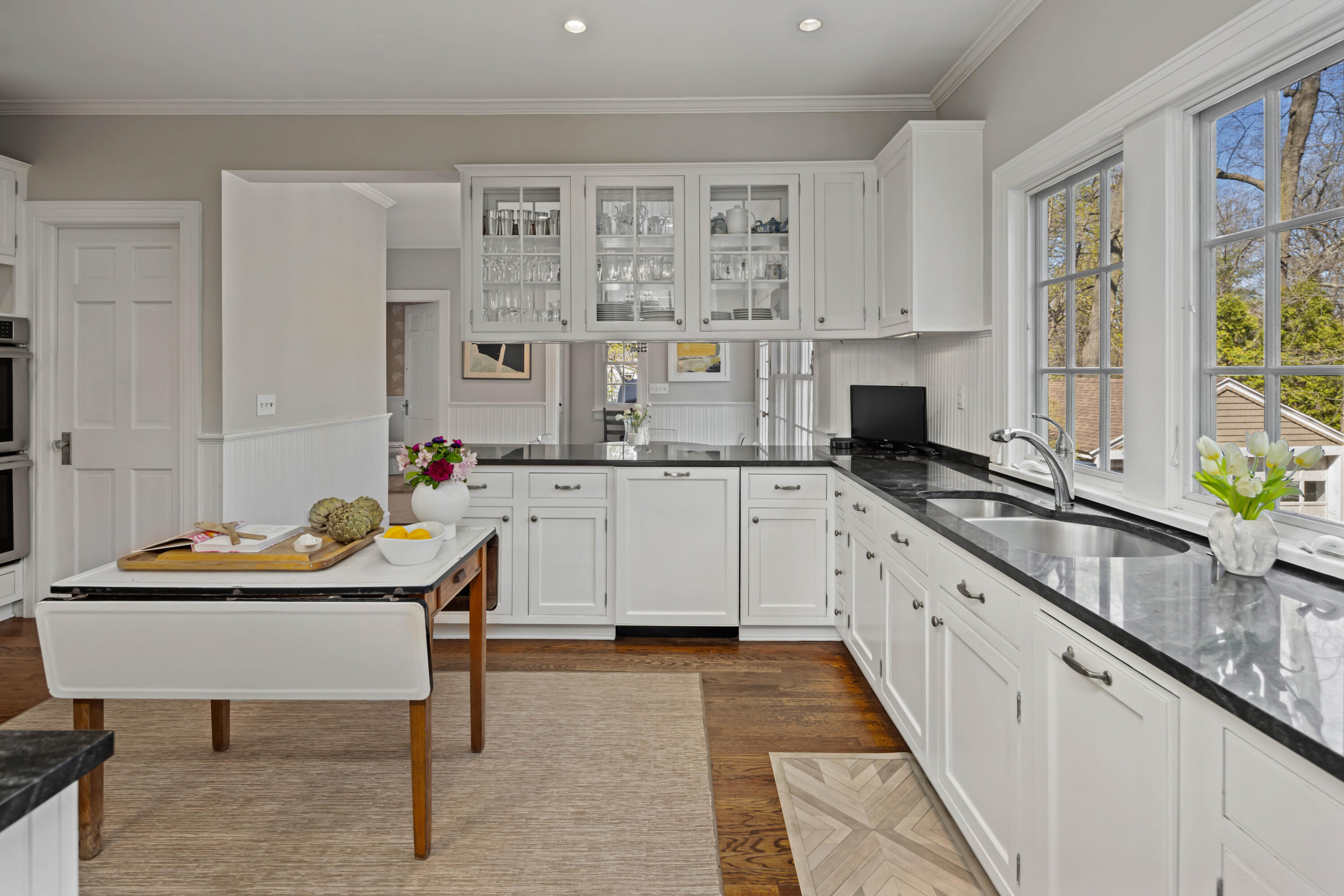 3 Edgehill Drive Darien, CT 06820 - Photo 12 of 40 a kitchen with stainless steel appliances kitchen island granite countertop a sink and cabinets