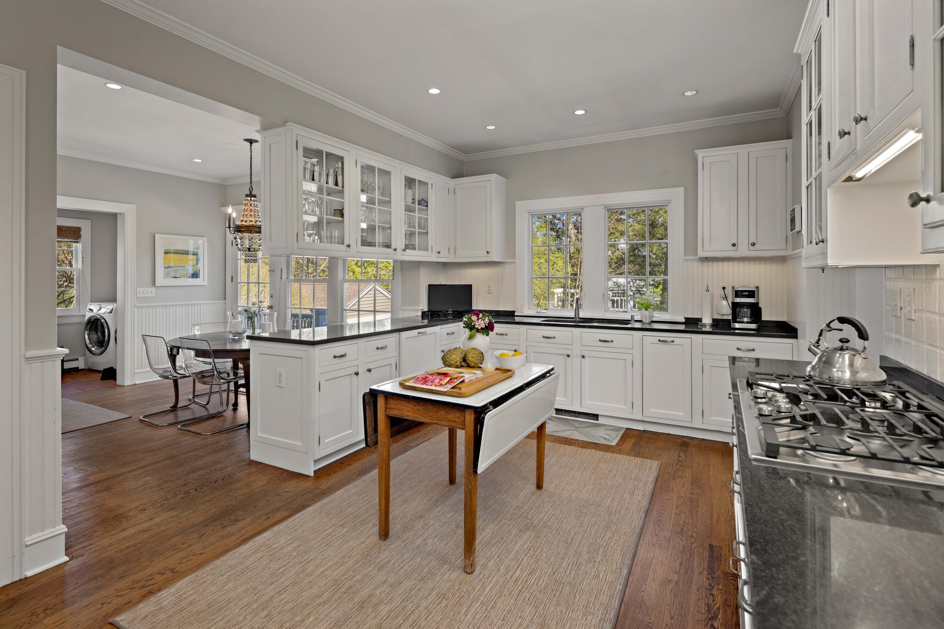 3 Edgehill Drive Darien, CT 06820 - Photo 13 of 40 a kitchen with counter top space a sink appliances and cabinets