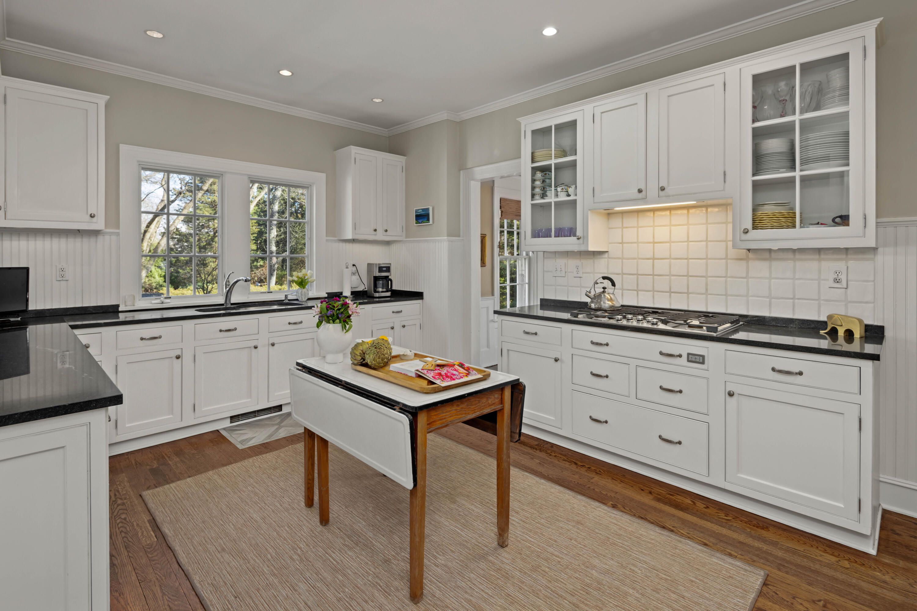 3 Edgehill Drive Darien, CT 06820 - Photo 16 of 40 a kitchen with a sink stove and cabinets