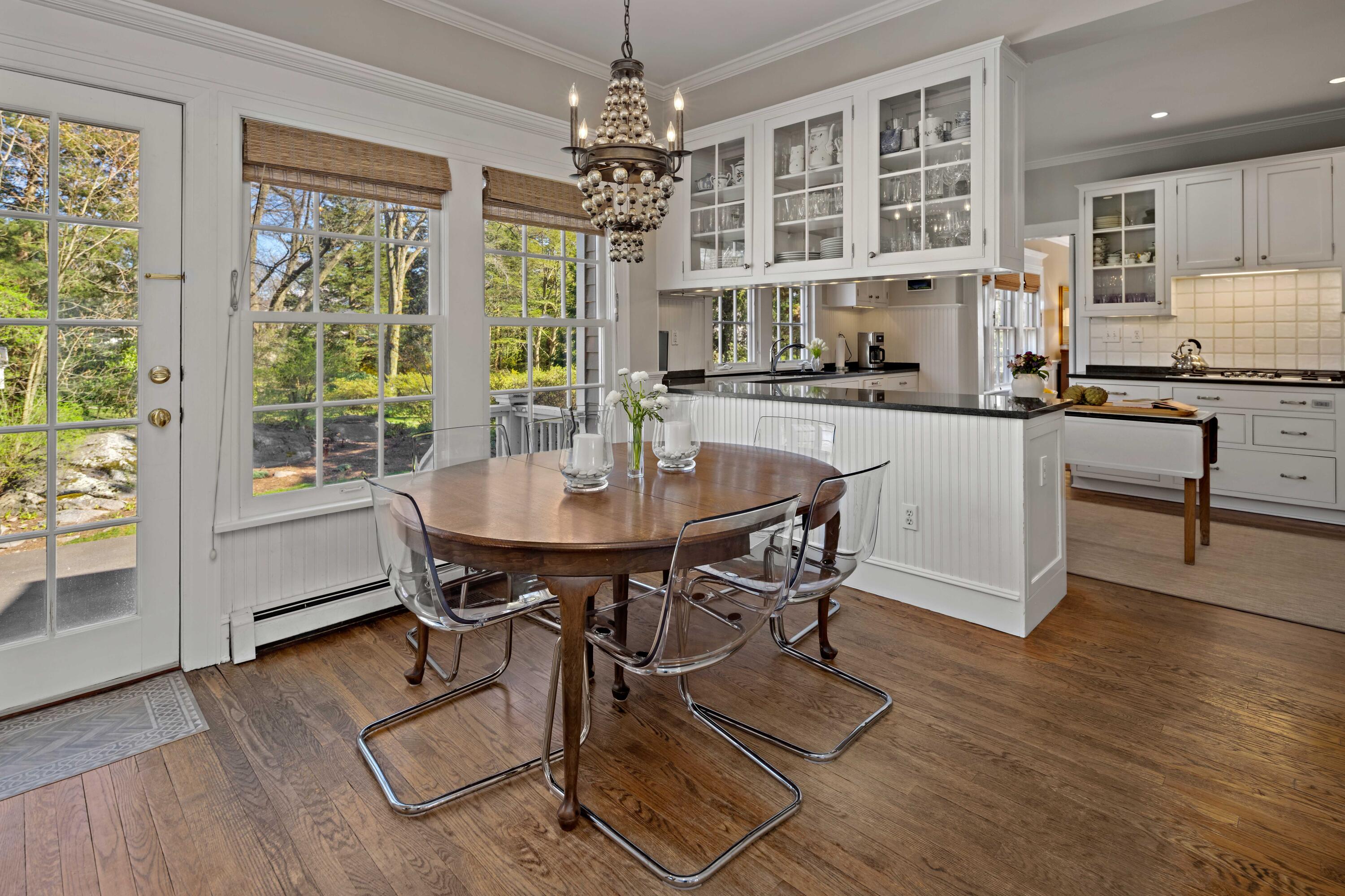 3 Edgehill Drive Darien, CT 06820 - Photo 17 of 40 a kitchen with a table chairs stove and cabinets