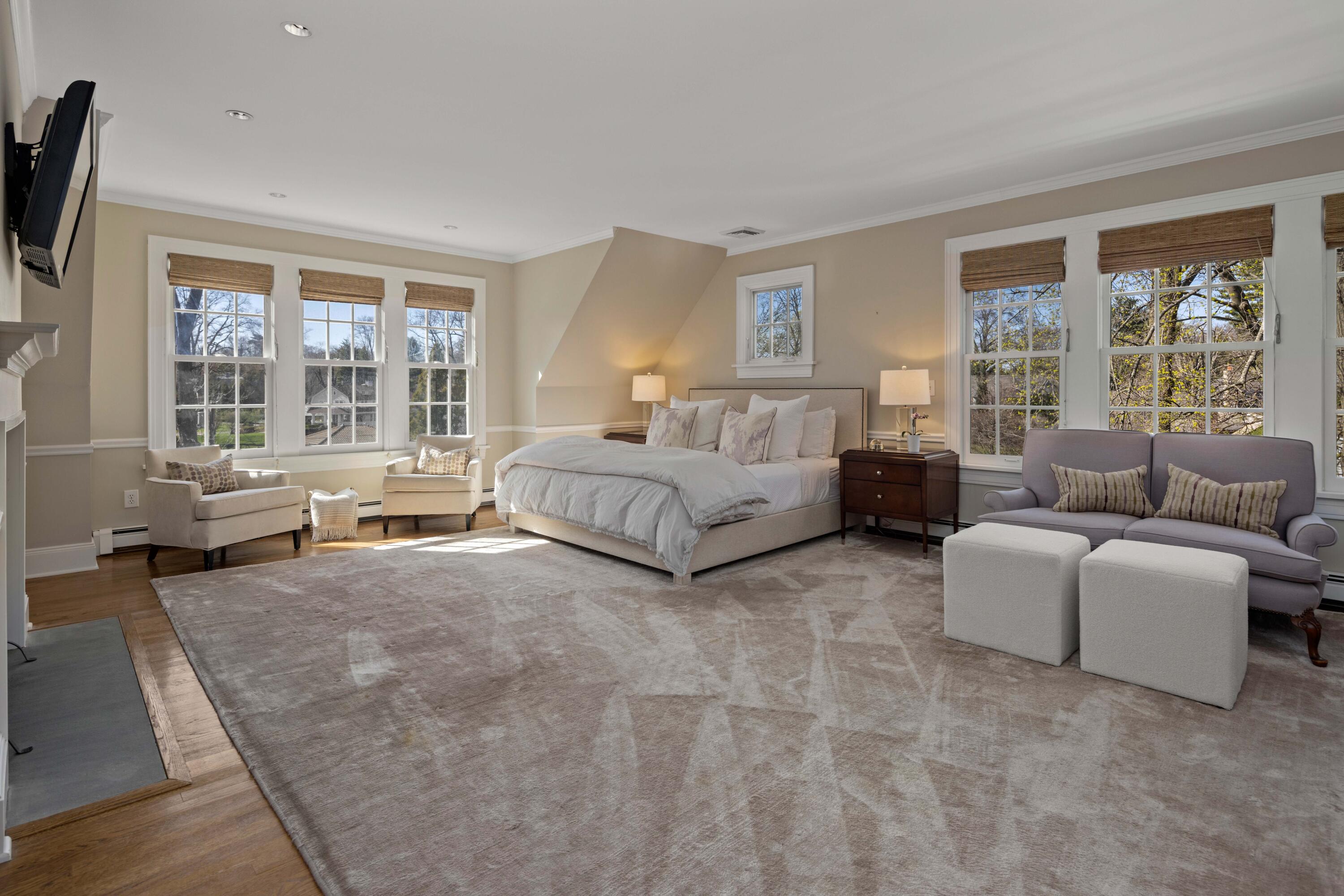 3 Edgehill Drive Darien, CT 06820 - Photo 22 of 40 a living room with couches and large windows with outer view
